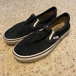Vans Black and White Slip-On Sneakers